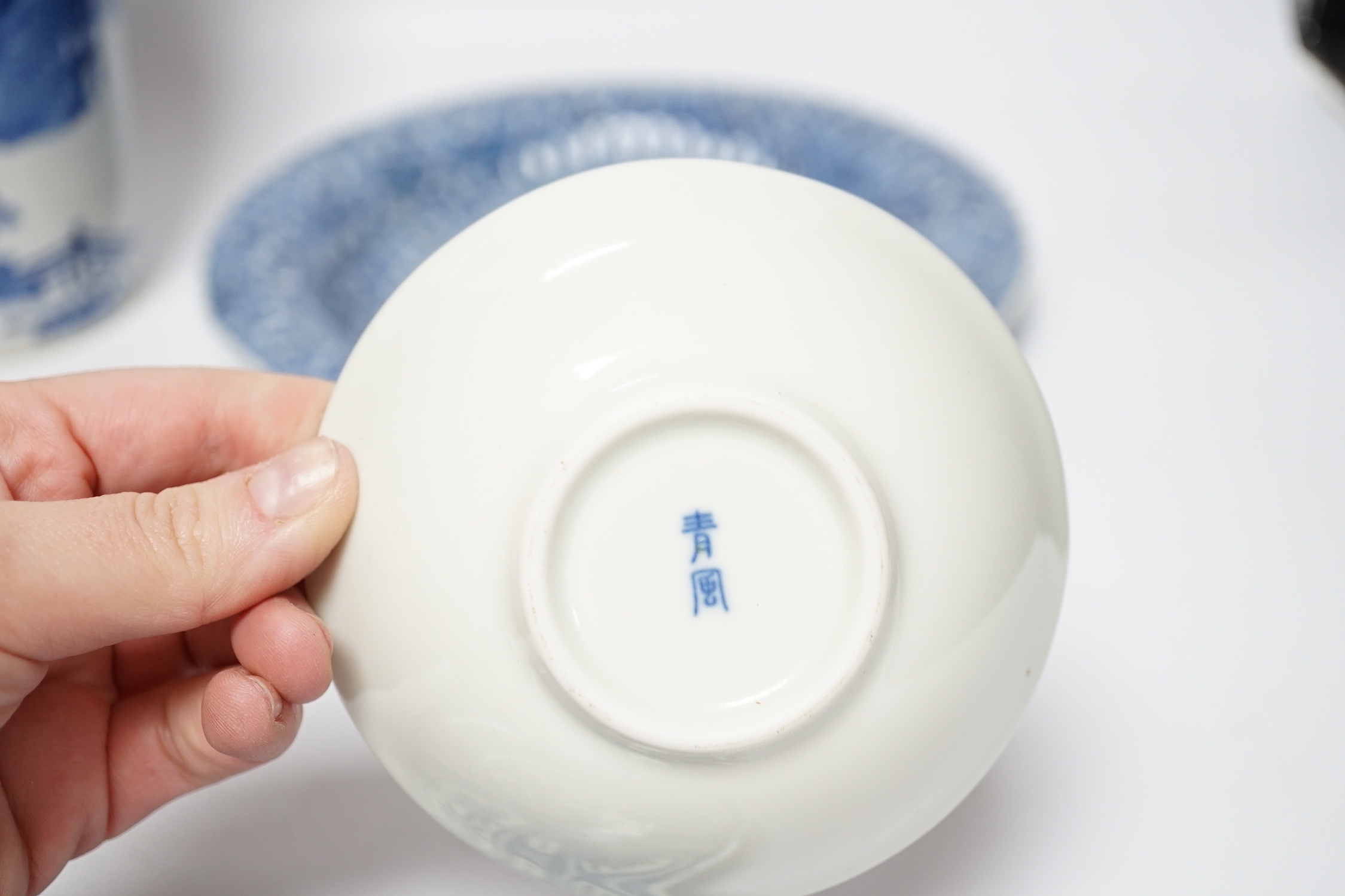 A group of Chinese blue and white dishes and plates and a damaged vase, 30cm